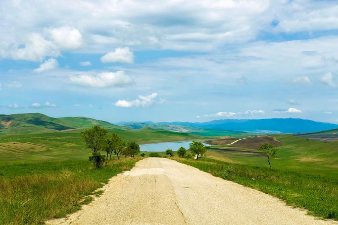 Gareja Sunrise Hike Tour from Tbilisi and Rainbow Hills Trail - Meet at the Giant Bicycle monument, then ride toward the semi-desert