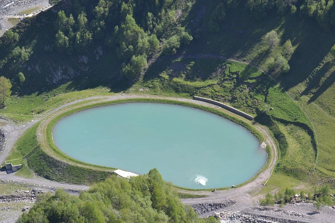 Kazbegi, Gergeti and Ananuri Full Day Tour from Tbilisi - Russian Georgian Friendship Monument: photo walls and the paragliding vibe