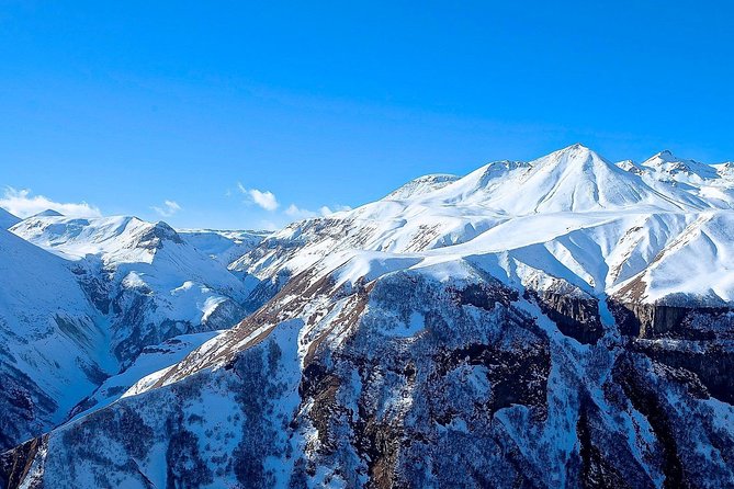 Kazbegi, Gergeti and Ananuri Full Day Tour from Tbilisi - Gudauri ski resort time: mountain air without committing to skiing