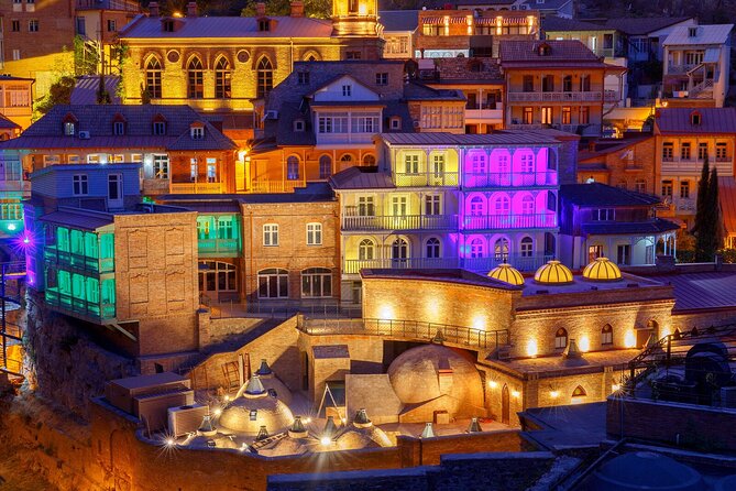 Tbilisi:Evening Walking & Talking Tour with Wine & Boat Ride - Rose Revolution Square and Rustaveli Avenue: Modern Tbilisi’s Main Stage
