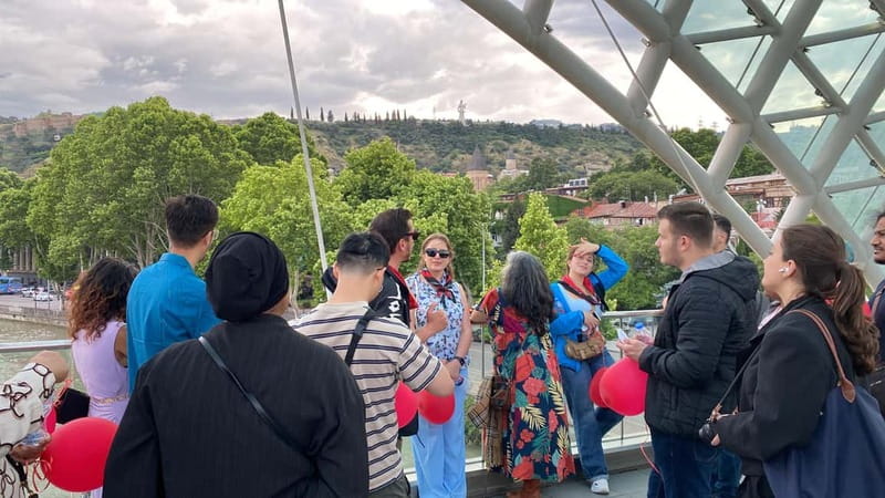 Tbilisi: Evening Walking Tour with Wine & Boat Ride Options - Logistics That Matter: Meeting Point, Shoes, Umbrella, and Small Group Feel