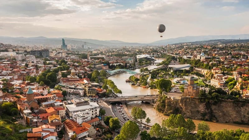 Tbilisi: Old Town Highlights w/ 5 Tastings & Cable Car Ride - The First Stops: Pickup, Photo Breaks, and the Clock Tower to Anchiskhati