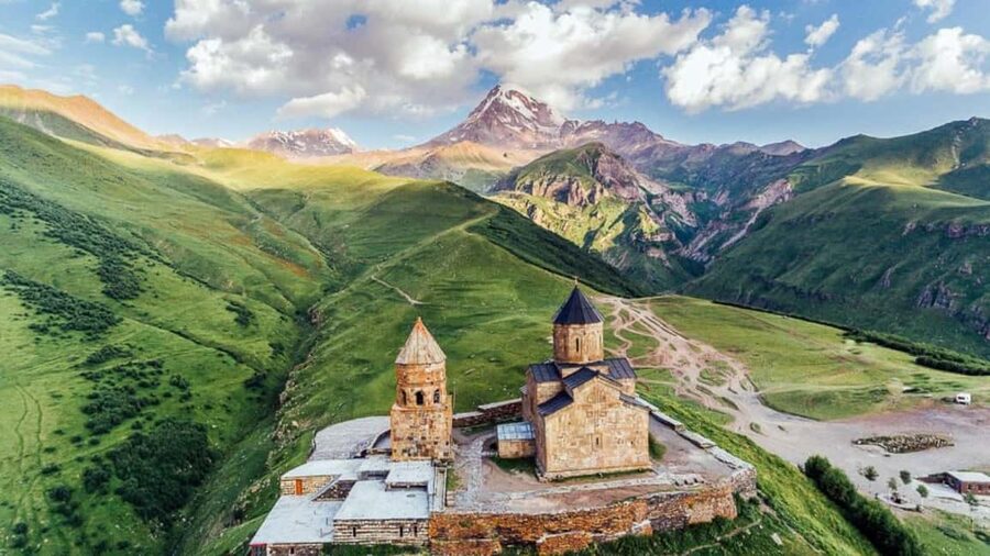 Tbilisi to Kazbegi Gudauri Ananuri Zhinvali Group GuidedTour - Stepantsminda and the long build-up to Gergeti Trinity Church
