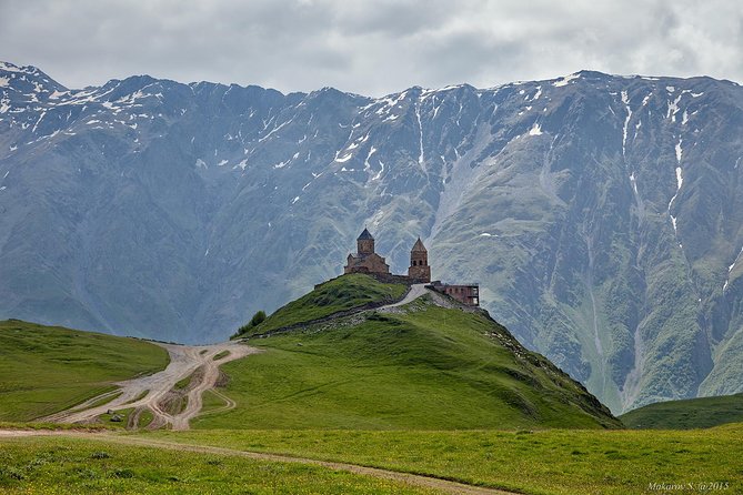 To The Majestic Kazbegi Full Day tour - Stop 1: Zhinvali Water Reservoir, blue water and mountain walls